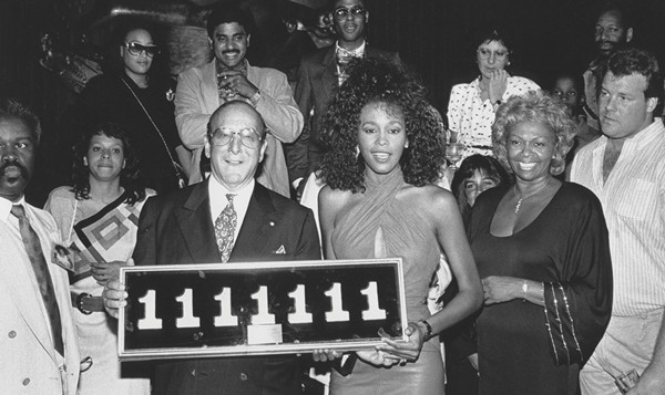 Clive Davis with Whitney Houston, celebrating her seven straight #1 singles